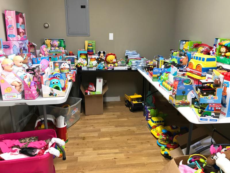 Tables of toys for the Christmas Store.